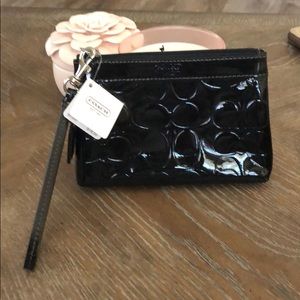 Shiny black Coach wristlet